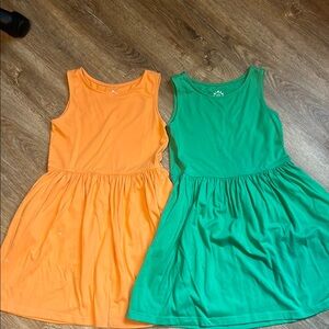 Lot of 2 Primary Sleeveless Orange and Green Dresses-small marks size 8-9